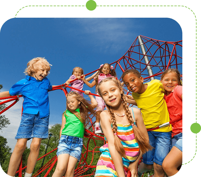 A group of children standing around in front of a net.