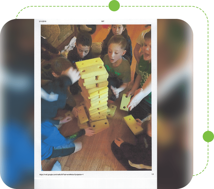 A group of children playing with blocks on the floor.