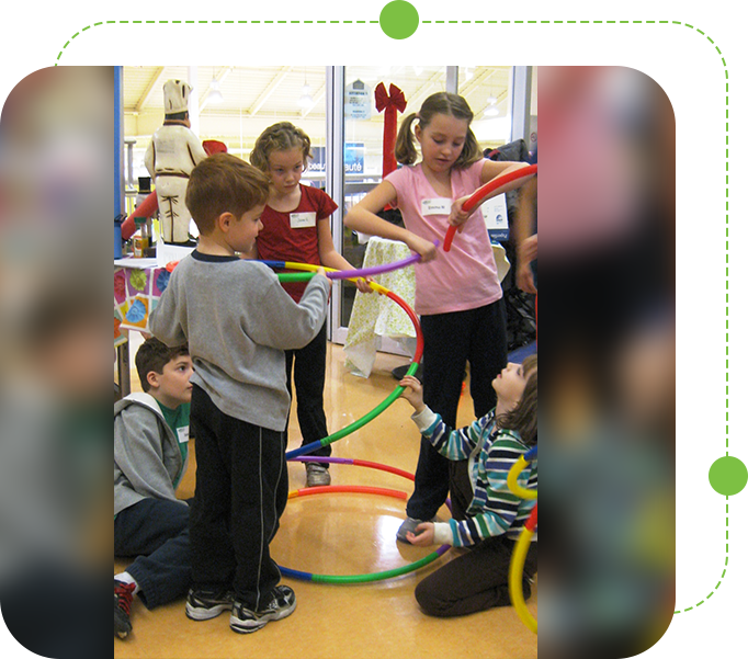 A group of children playing with hula hoops.