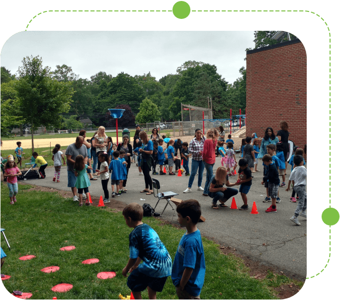 A group of children playing frisbee golf in the park.